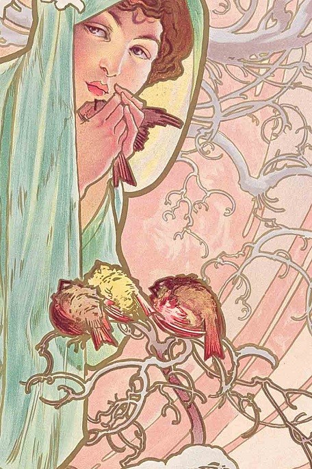 Close up of a dark haired woman wrapped in pale green drapery with a small bird in her hands