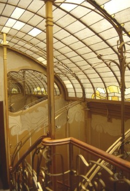 La Maison Horta, Brussels Ornate Art Nouveau staircase below an arched glass ceiling incorporating decorative metalwork
