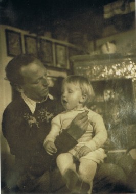 Jiří and John Mucha John Mucha sits on his father's knee in an interior