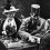 Archduke Franz Ferdinand and his wife the day of their assassination The couple sit in a carriage; the Archduchess holds a bouquet as the Archduke shakes hands with a man in a suit