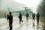 Russian helicopter brought down by Chechen fighters Helicopter surrounded by armed men in uniform on a wet winter day