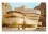 The Guggenheim Museum, New York A vintage photo of Wright's building resembling a white ribbon curled into a cylindrical stack that is slightly wider at the top than the bottom