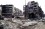 View of Grbavica, a neighbourhood of Sarajevo A series of devestated and empty buildings surrounded by rubble and burned out cars