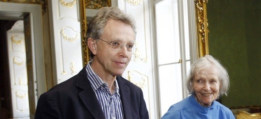 Head and shoulders of John Mucha and his mother Geraldine in a period room