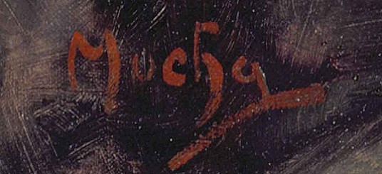 Mucha signature Signature in red paint on a dark background